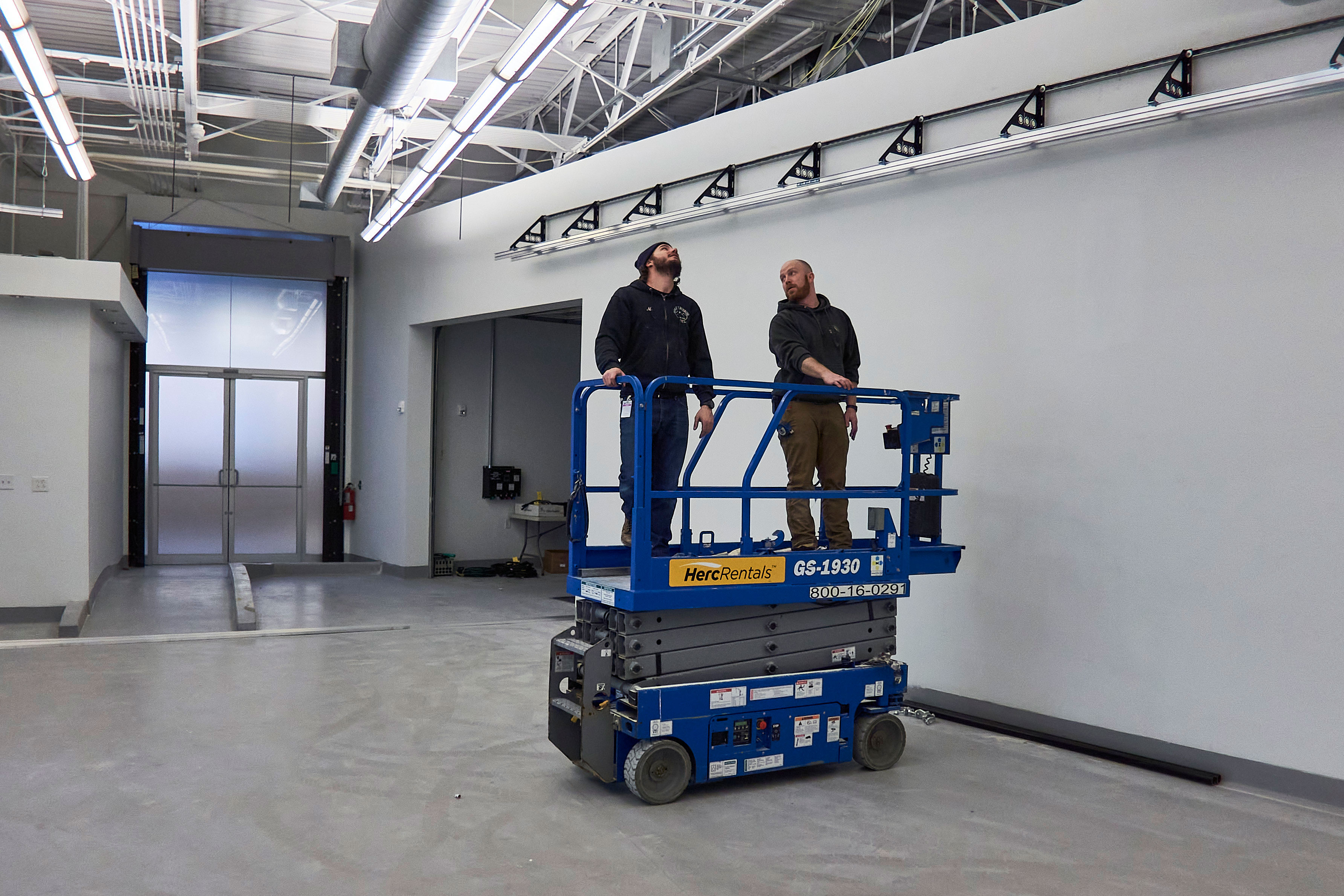 Men Consulting on a Studio Installation